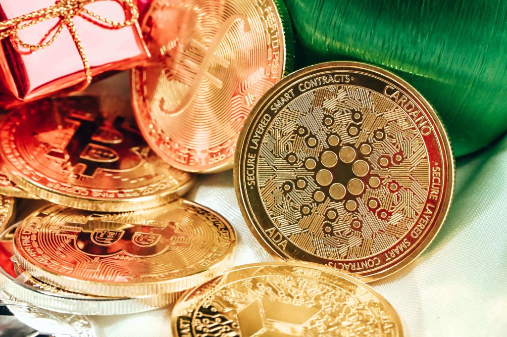A gift box and various cryptocurrency coins