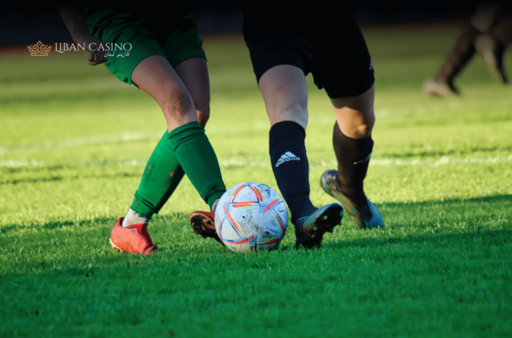 Two football players fights for the ball