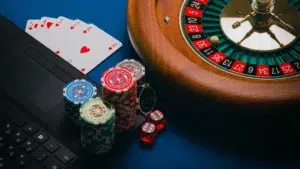 Playing cards, a roulette wheel, and a chip set